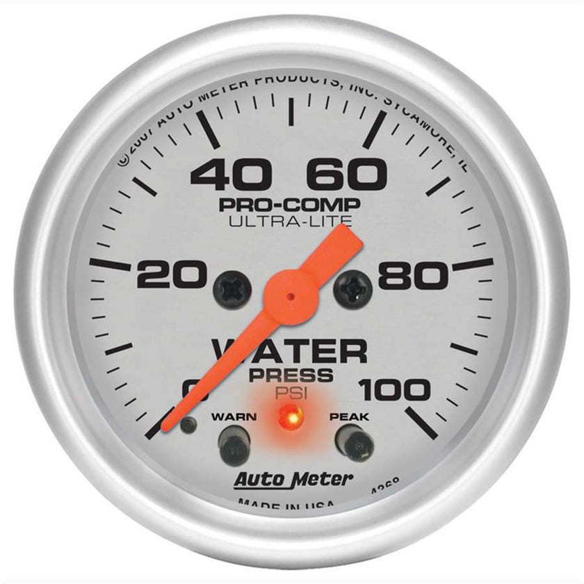 Traditional incandescent lighting illuminates around the perimeter of the dial